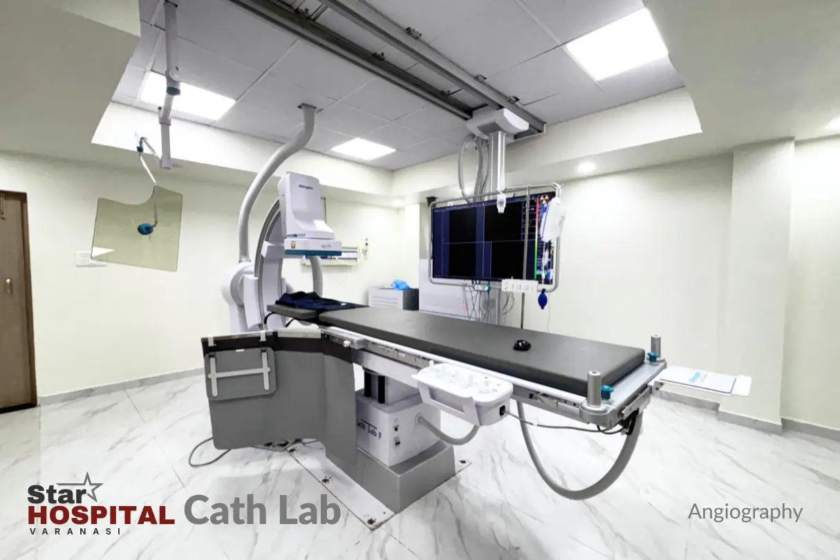 Interventional cardiologist performing coronary angiography inside advanced flat-panel digital cath lab at Star Hospital Varanasi