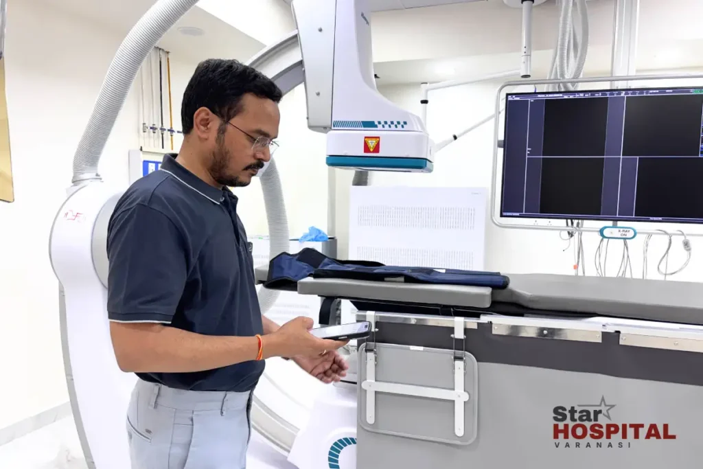 Senior interventional cardiologist Dr Gopal Krishna Rai reviewing digital imaging system inside Cath Lab at Star Hospital Varanasi